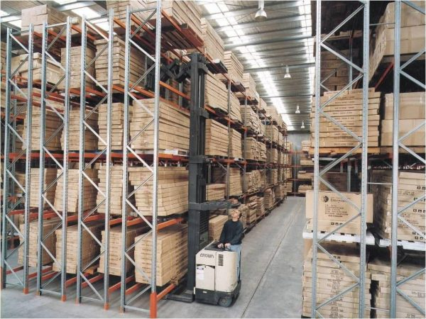 Deep-reach forklift accessing double-deep rack